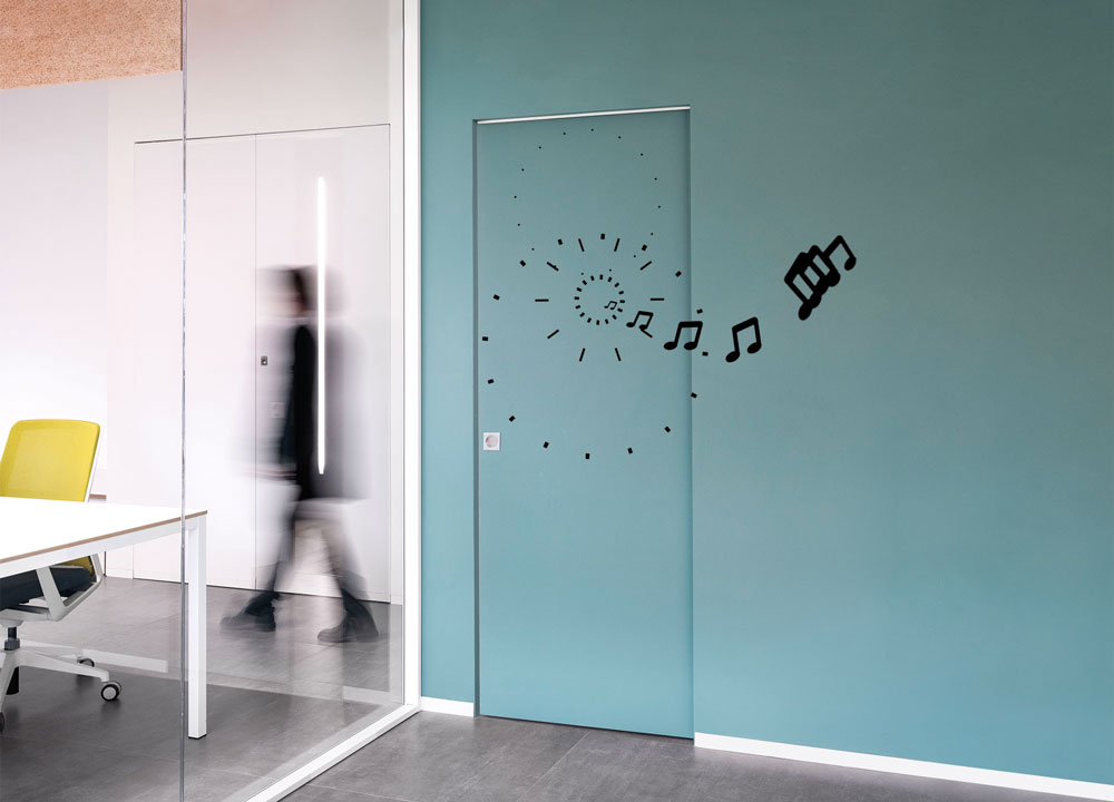 Flush pocket door with acoustic performance
